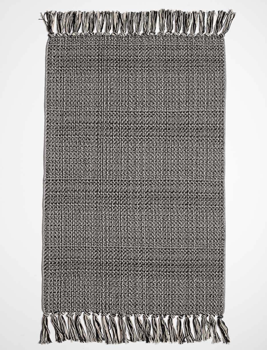 Tapis tissé à franges
