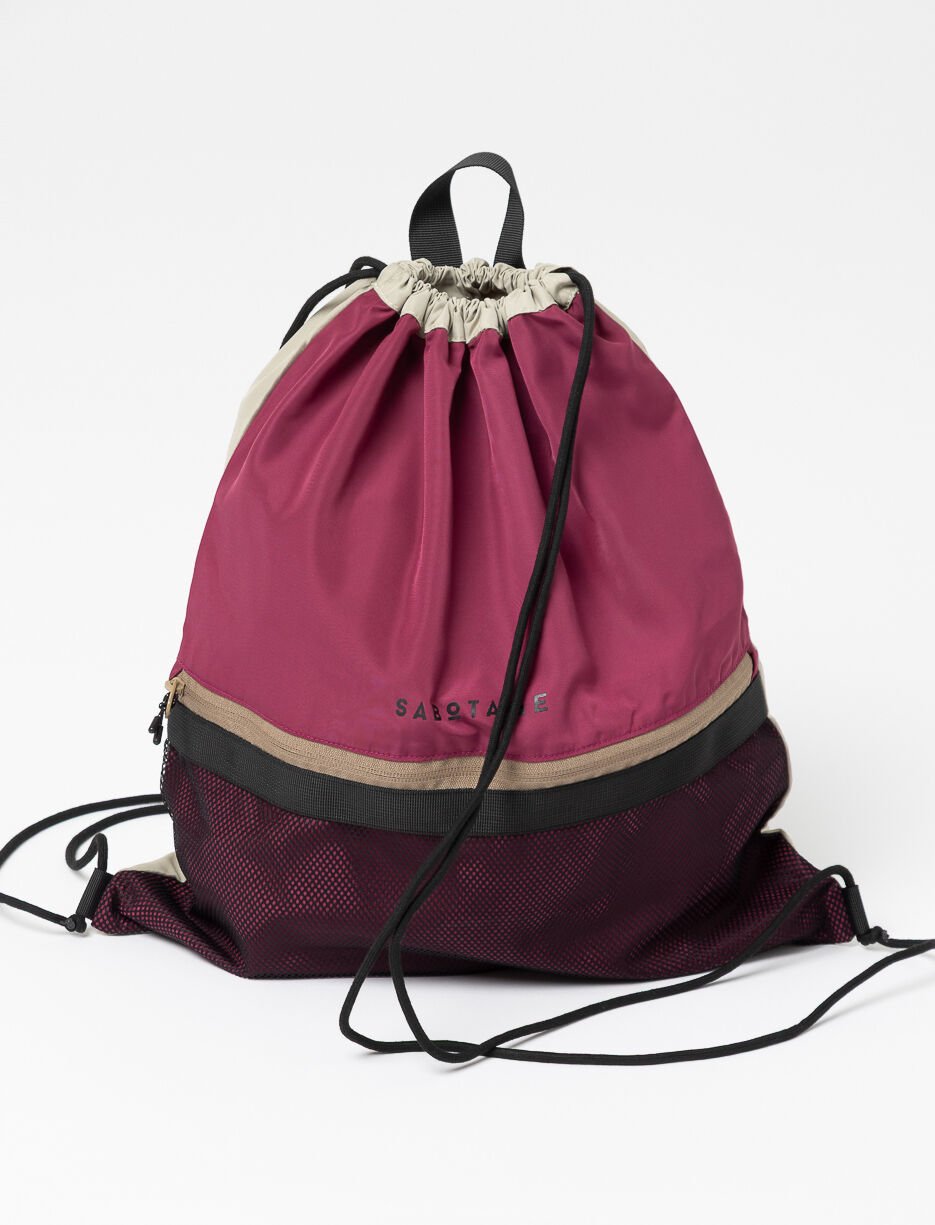 Pink drawstring bag with mesh pocket