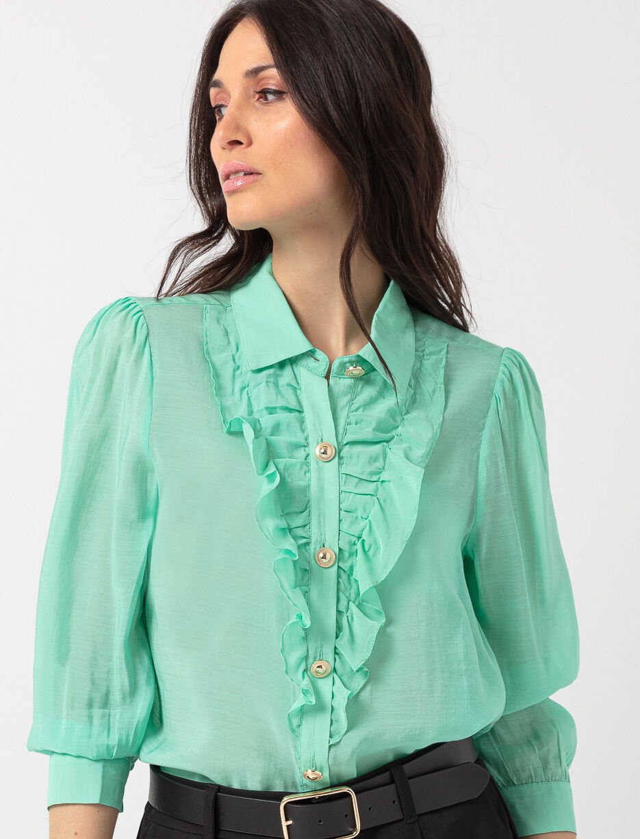 Chemise transparente à volants